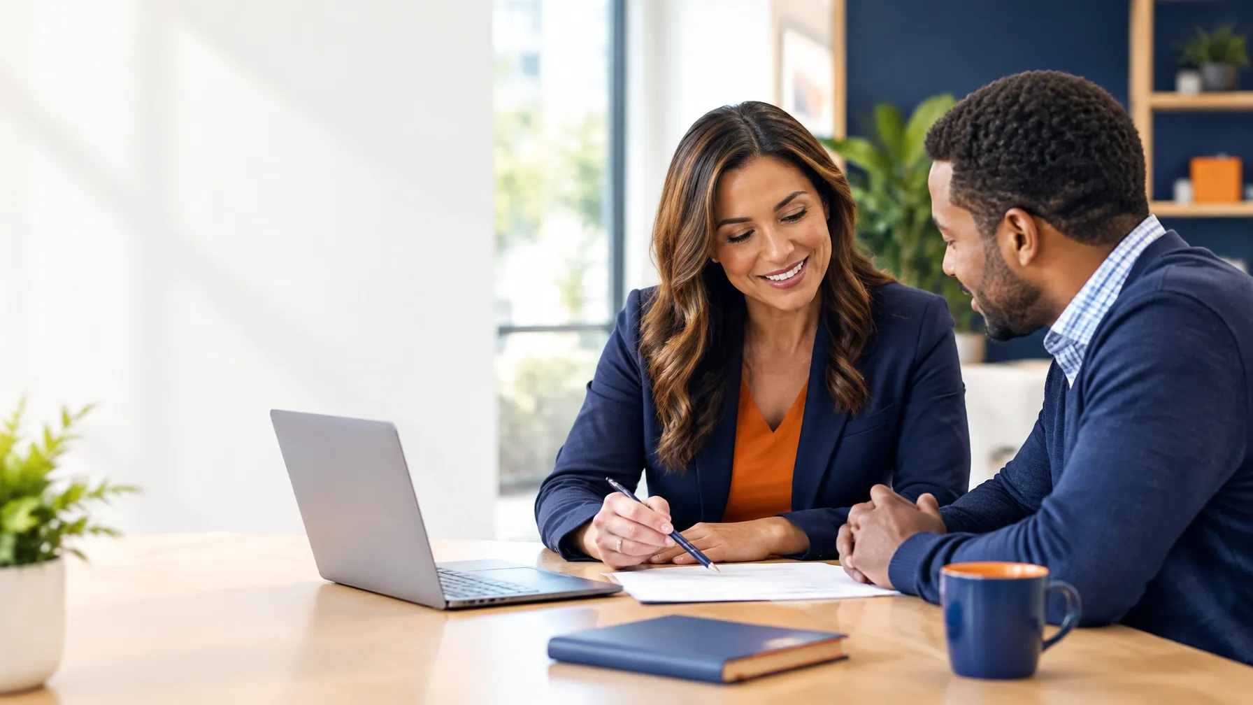 Two advisors discussing a client question at a bright office table