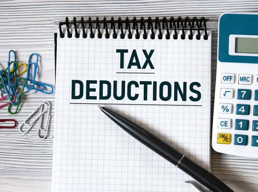 Tax planning notepad and calculator representing Employee Retention Tax Credit review