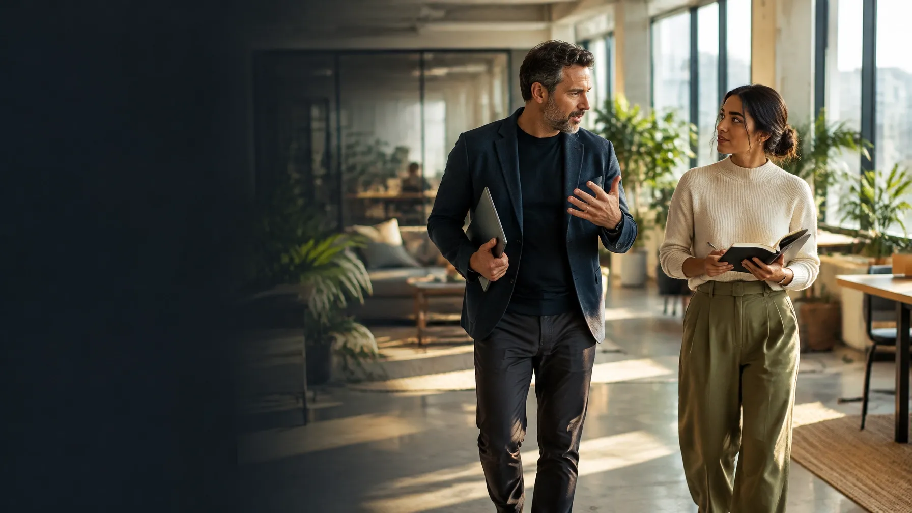 Mentor and founder walking through a workspace while discussing a growth plan